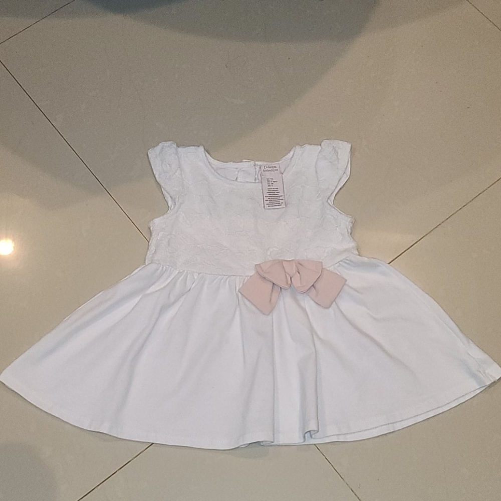 White blouse pink bow accent